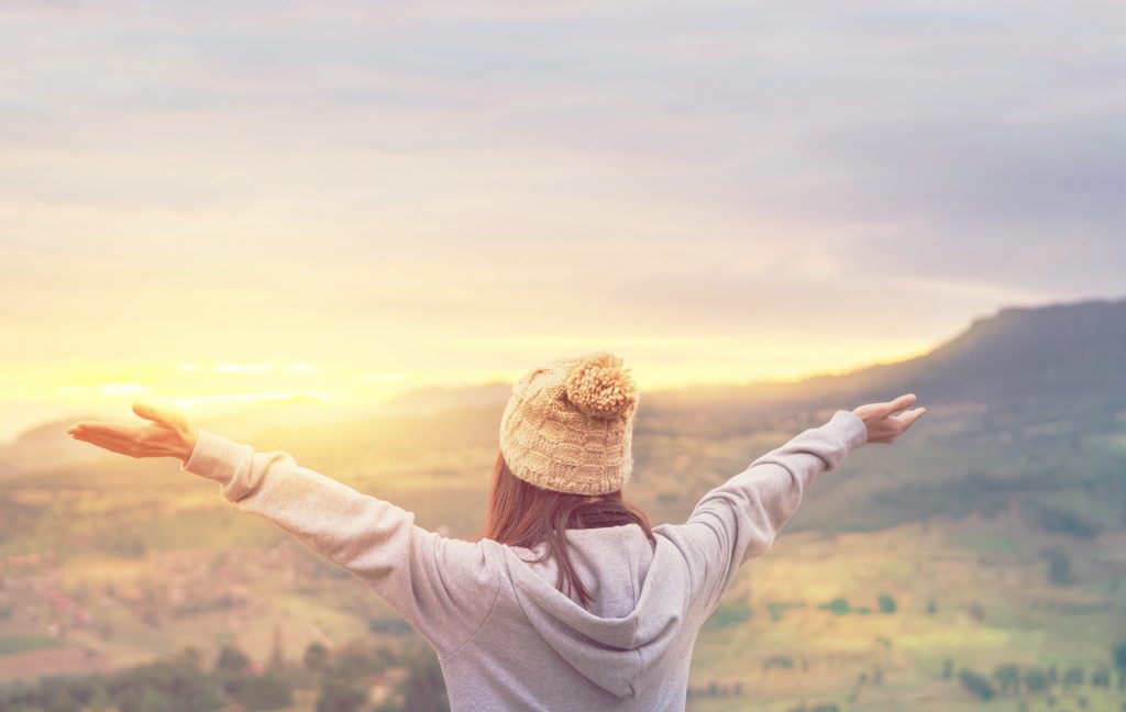 woman with arms stretched out