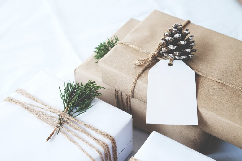 gifts wrapped with brown and white paper