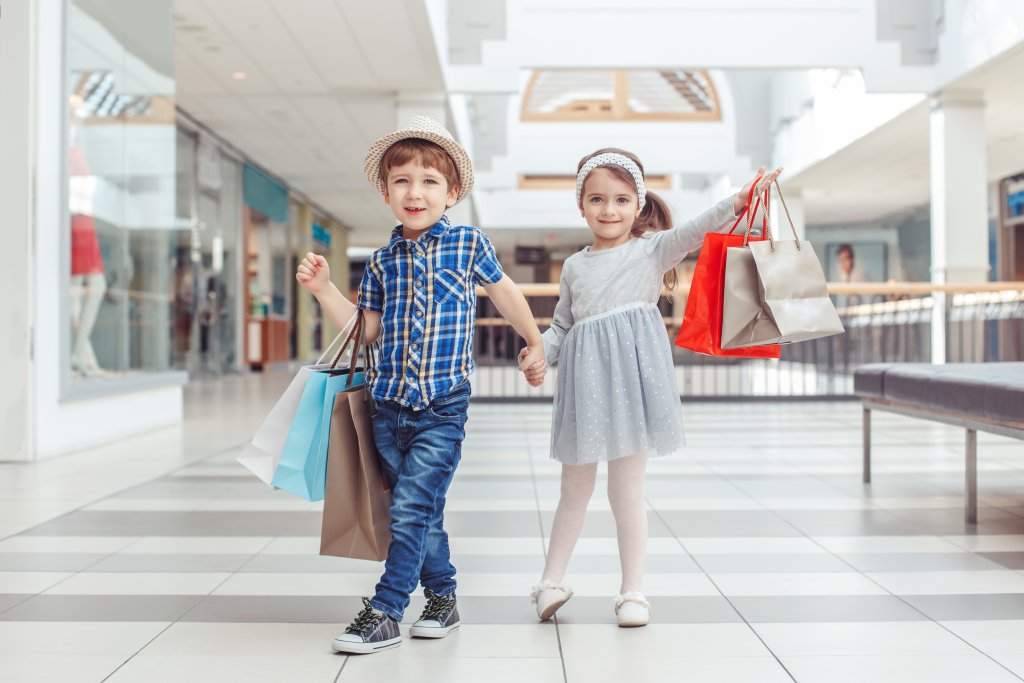 children holding shopping bags