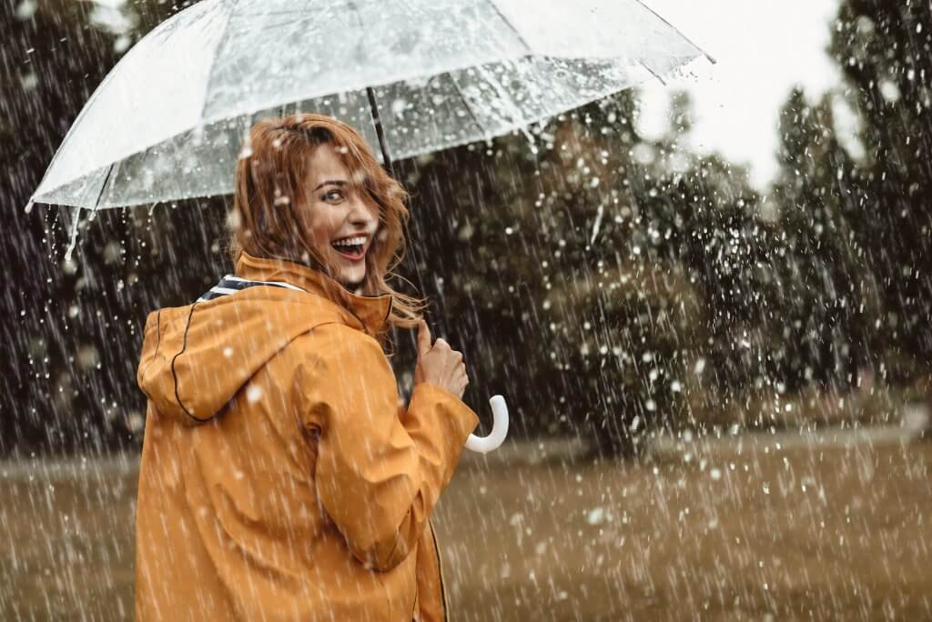 woman smiling in the rain