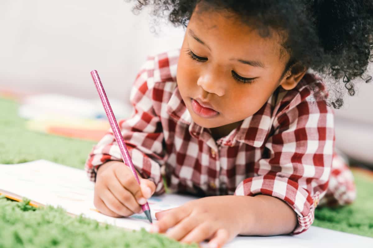 child doing art