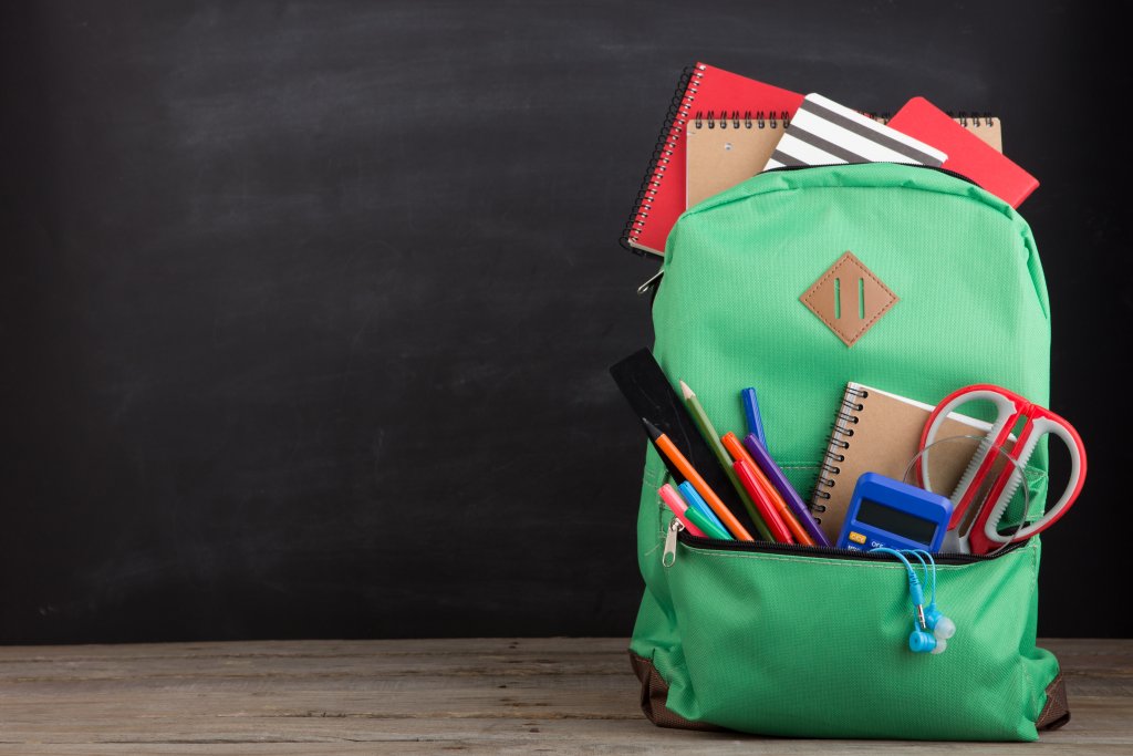 backpack with school supplies spilling out of it