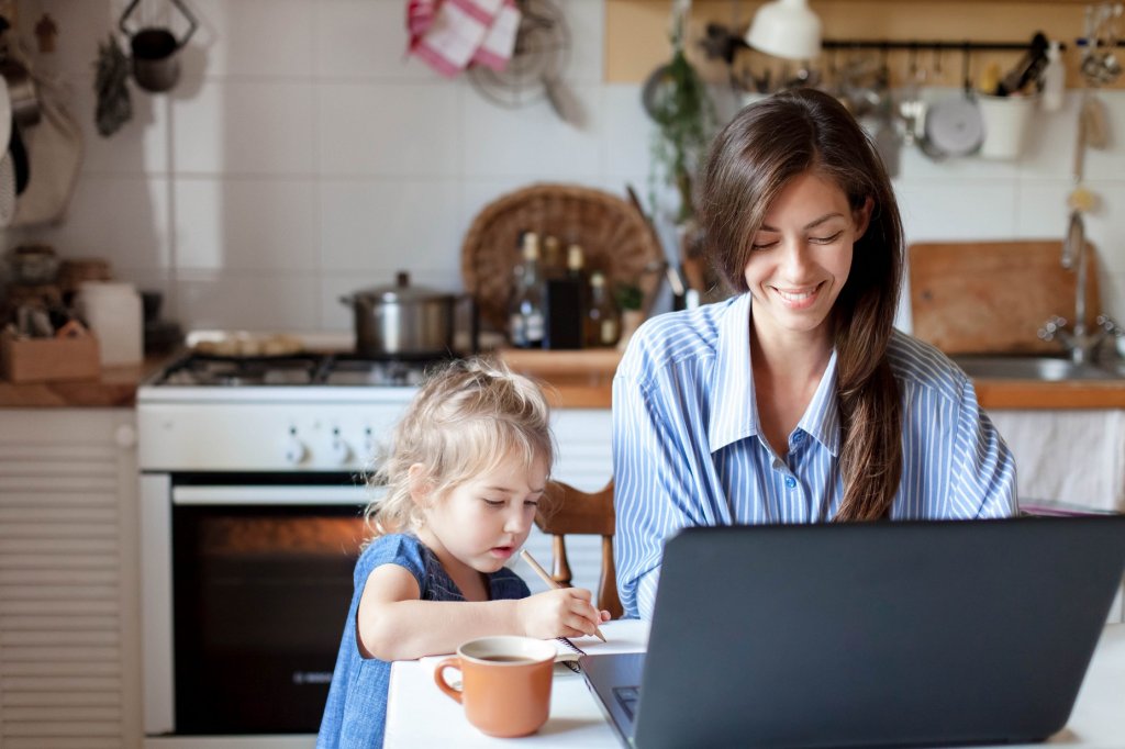 mom writing on a laptop