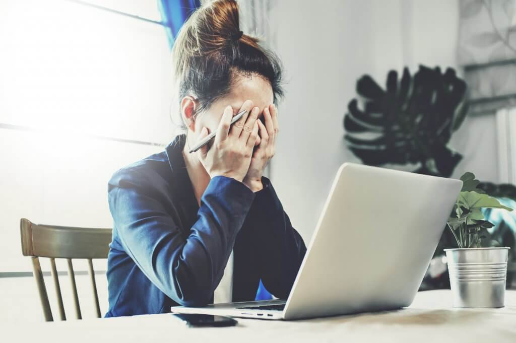 stressed woman working on computer