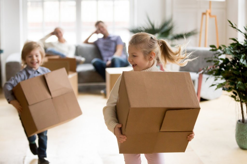 kids carrying boxes