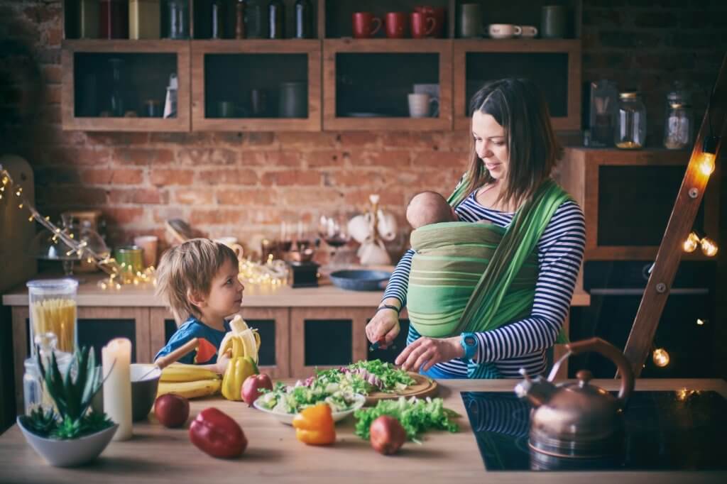 mom preparing food with her kids