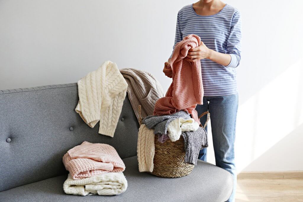 sorting through sweaters