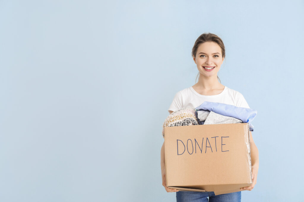 woman holding box of donations
