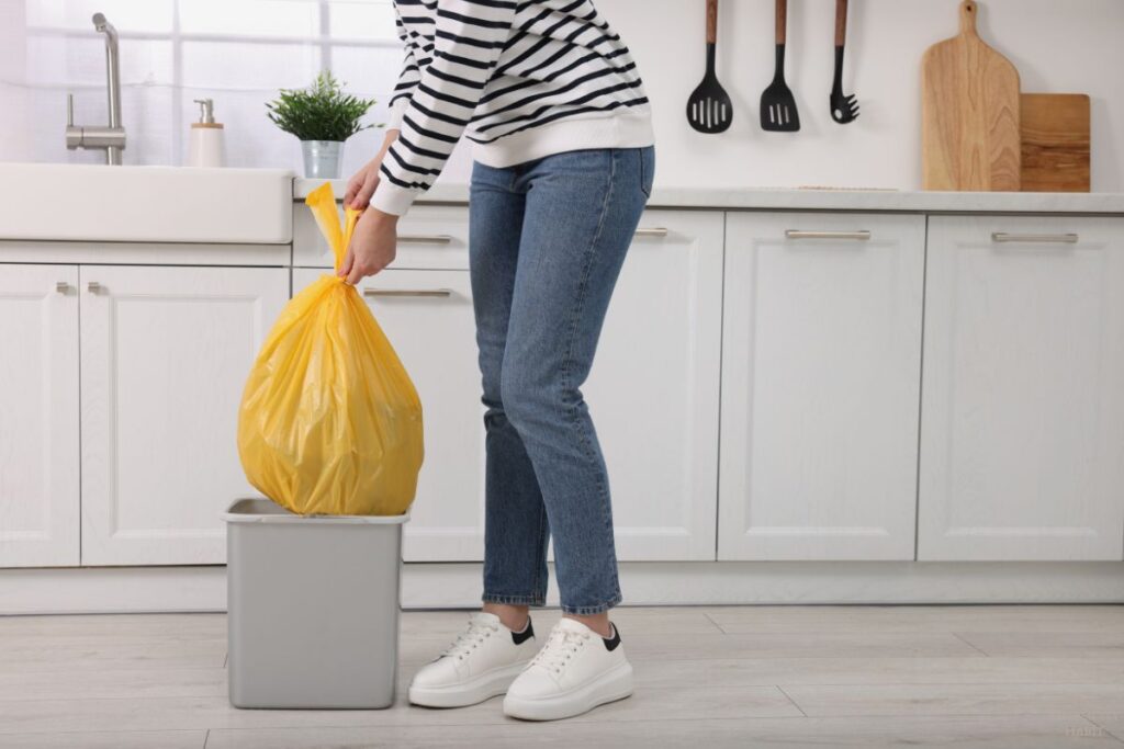 woman throwing trash away