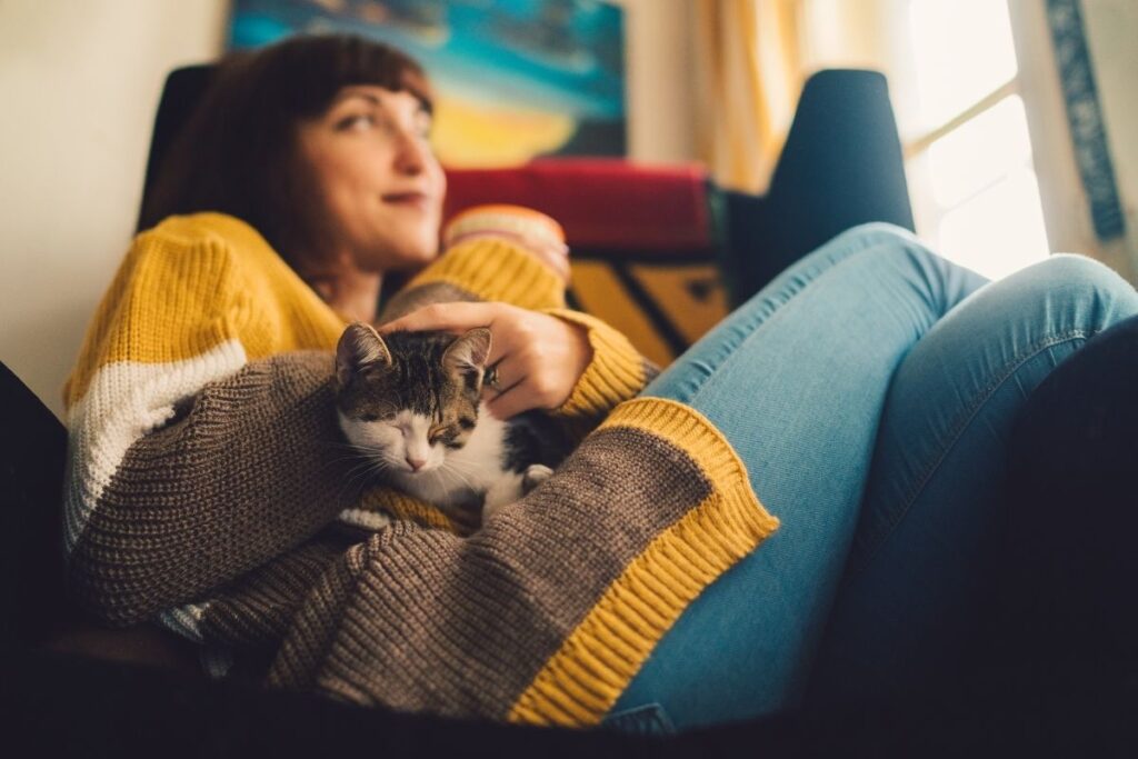 calm woman petting cat