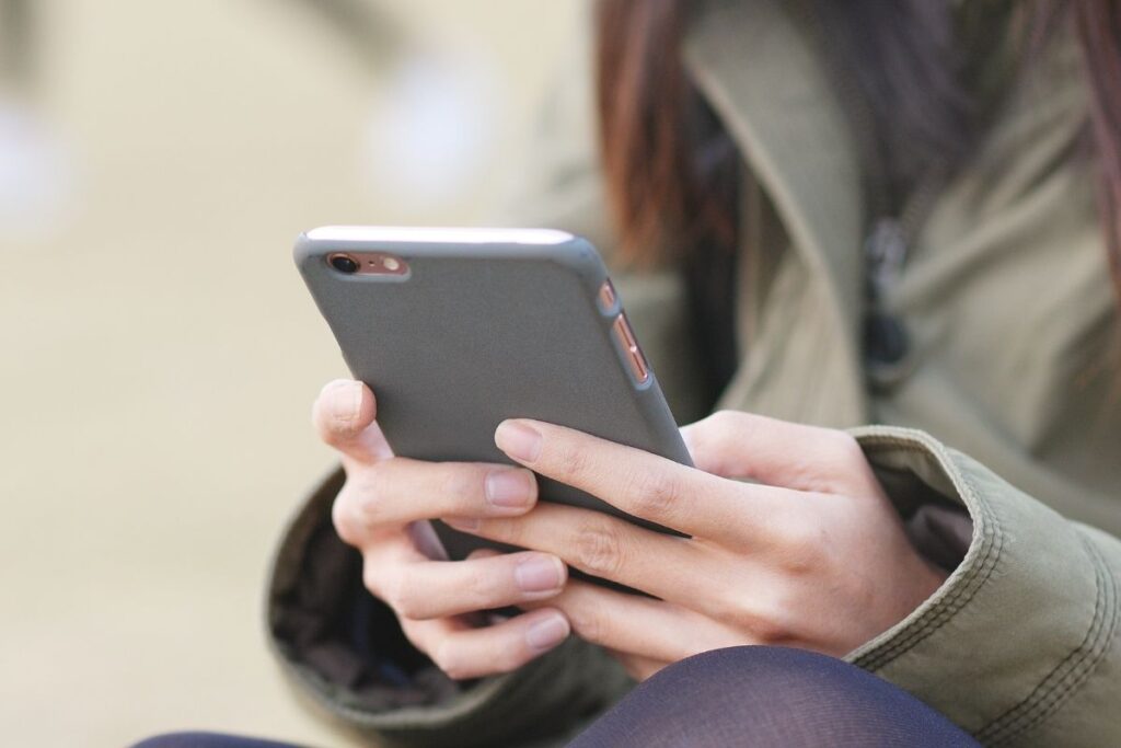 woman holding cellphone