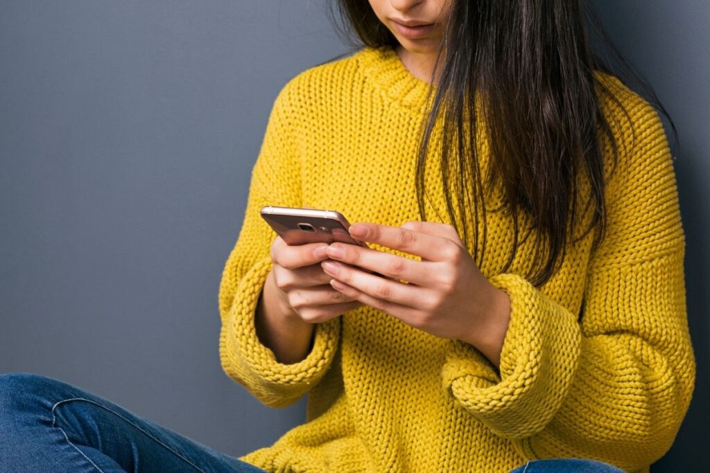 woman looking at phone