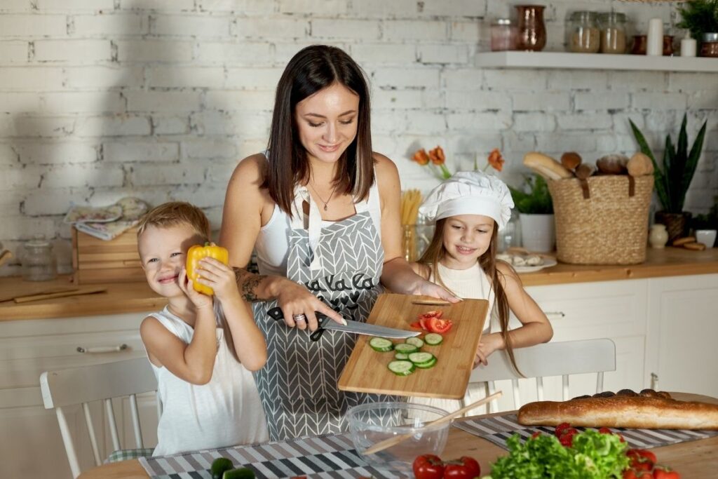mom preparing food with kids