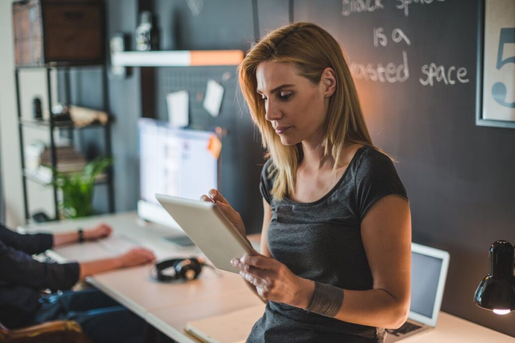 woman holding an ipad