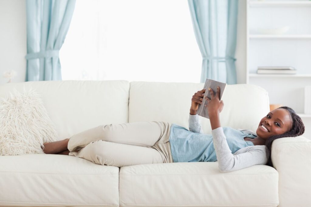 woman reading on couch