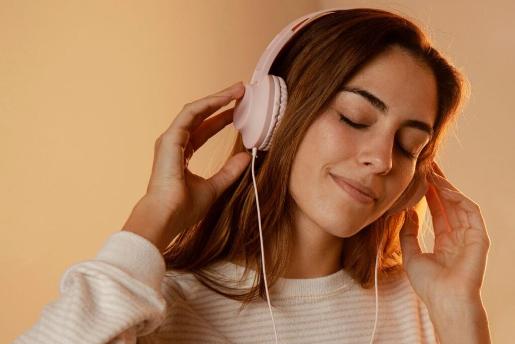 woman listening to music on headphones