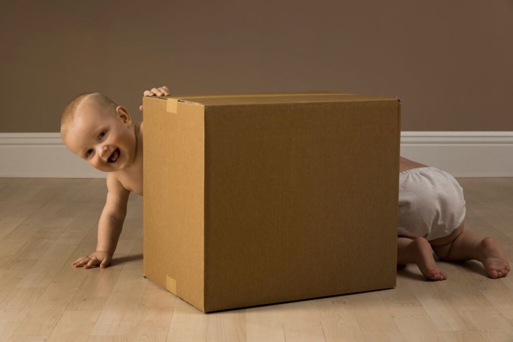 baby next to a box
