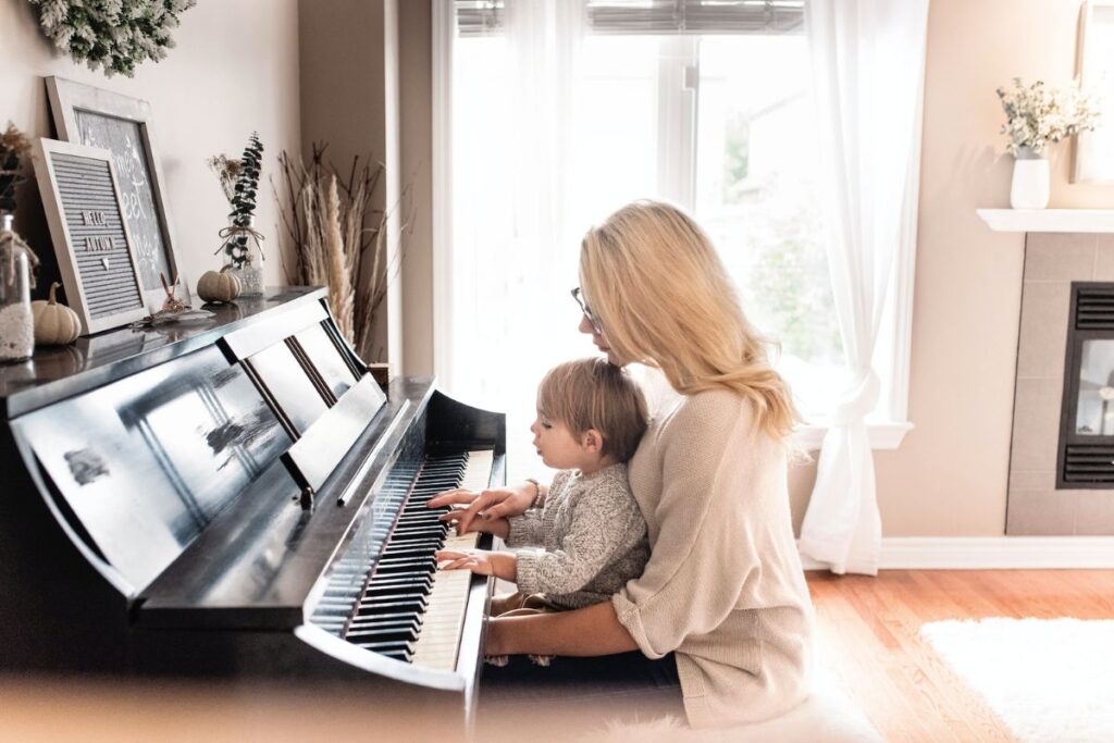 child learning to play piano