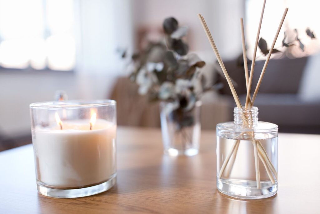 candle and diffuser on coffee table
