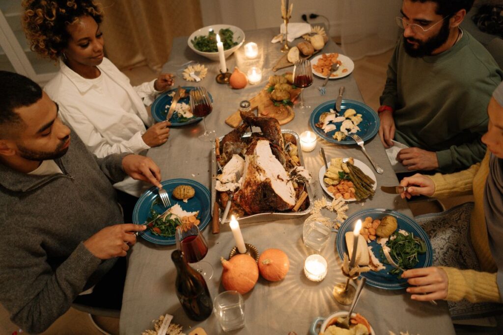 friends enjoying a Thanksgiving meal