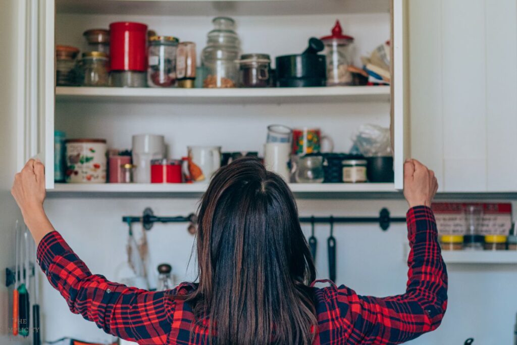 woman looking at kitchen shelves