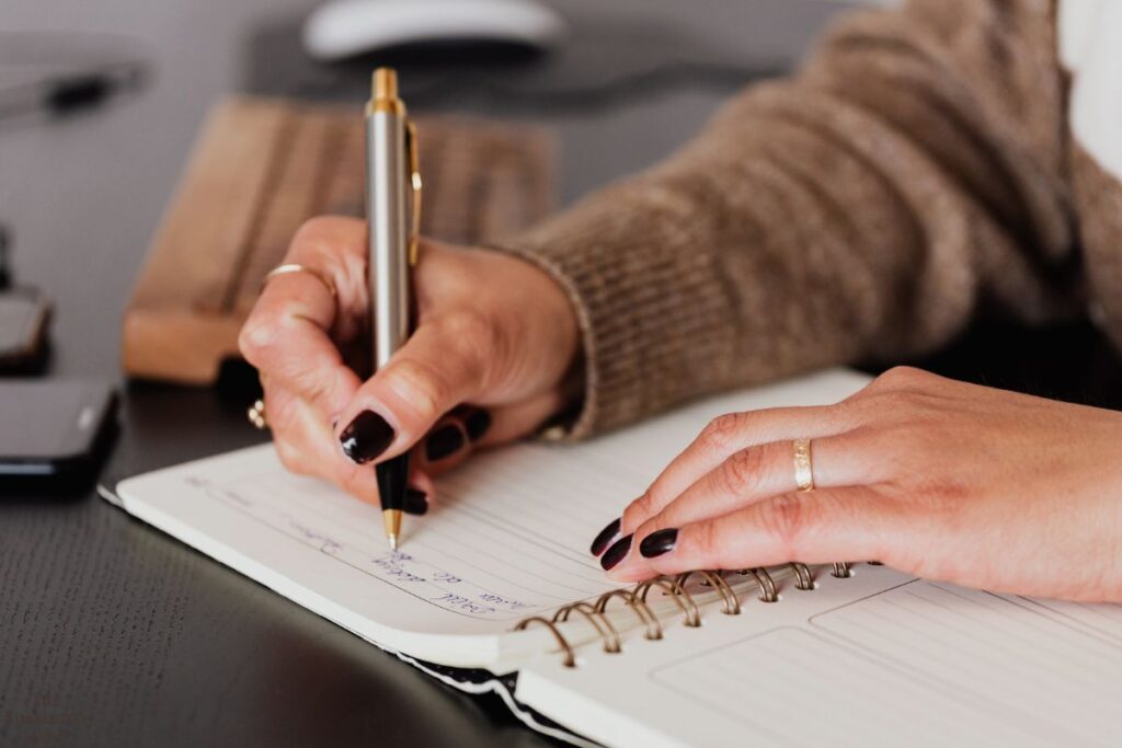 woman writing in a notebook