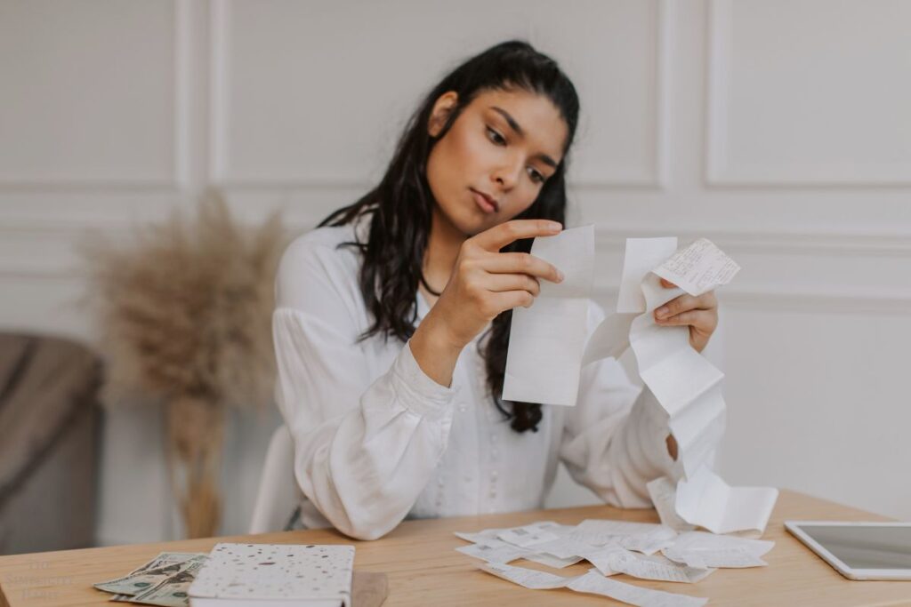 woman looking at receipts