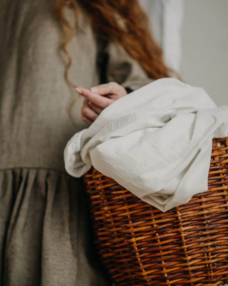 woman holding laundry basket
