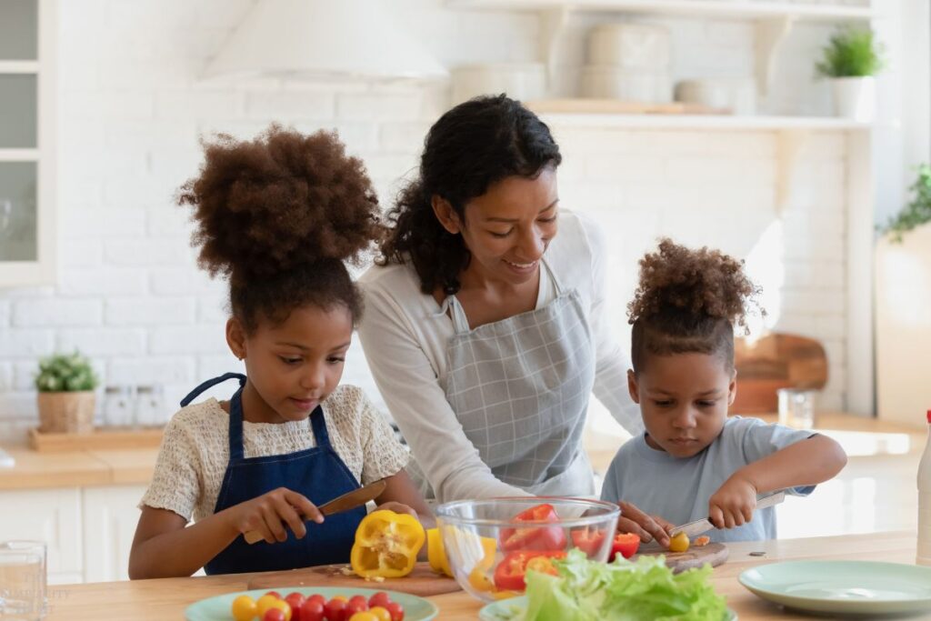 mom teaching kids to cook