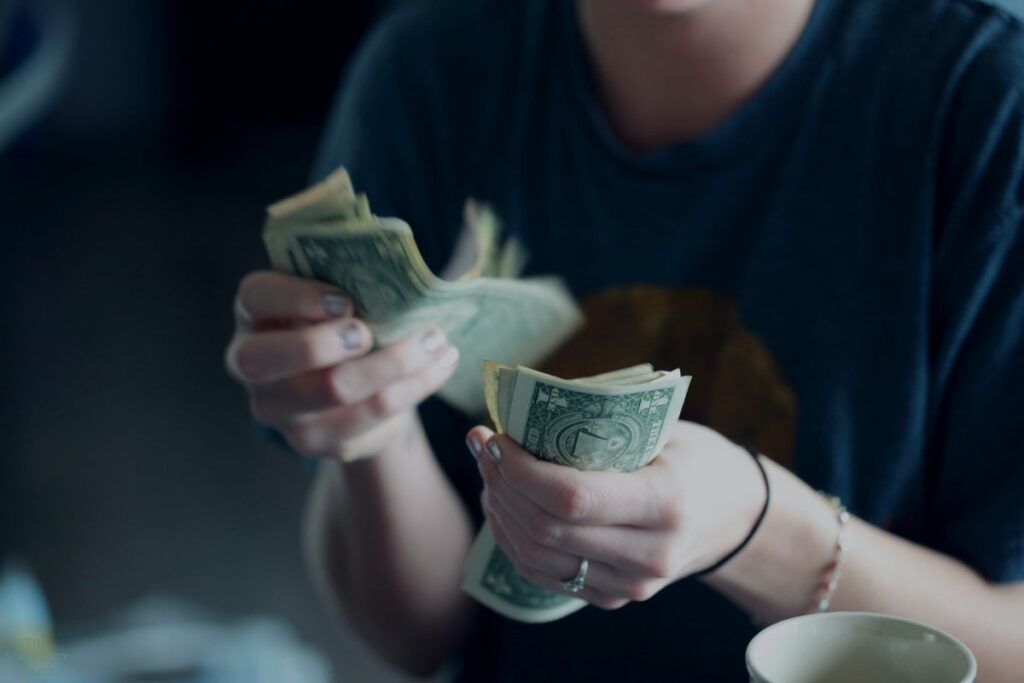 person holding cash