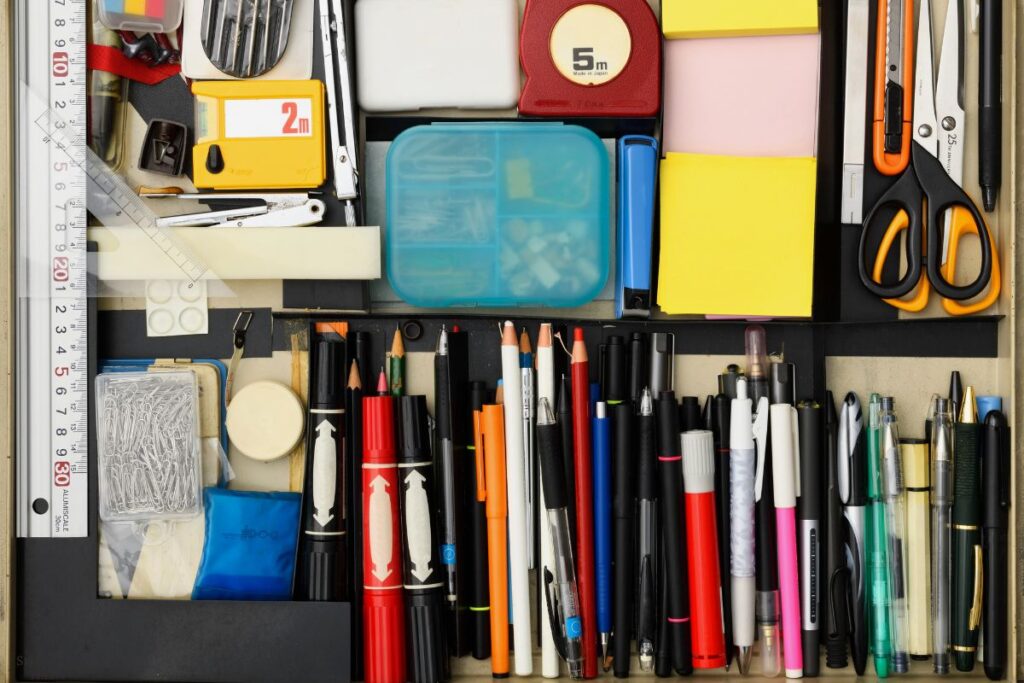 drawer of office supplies