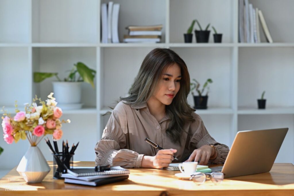 woman comparing prices on her laptop