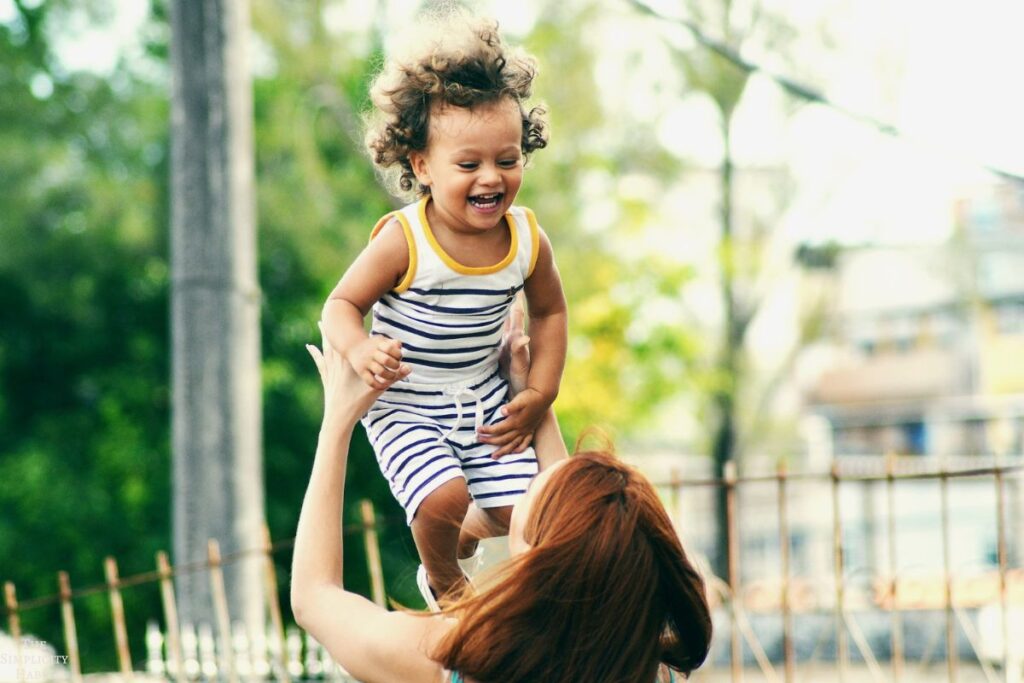 child smiling at his mom