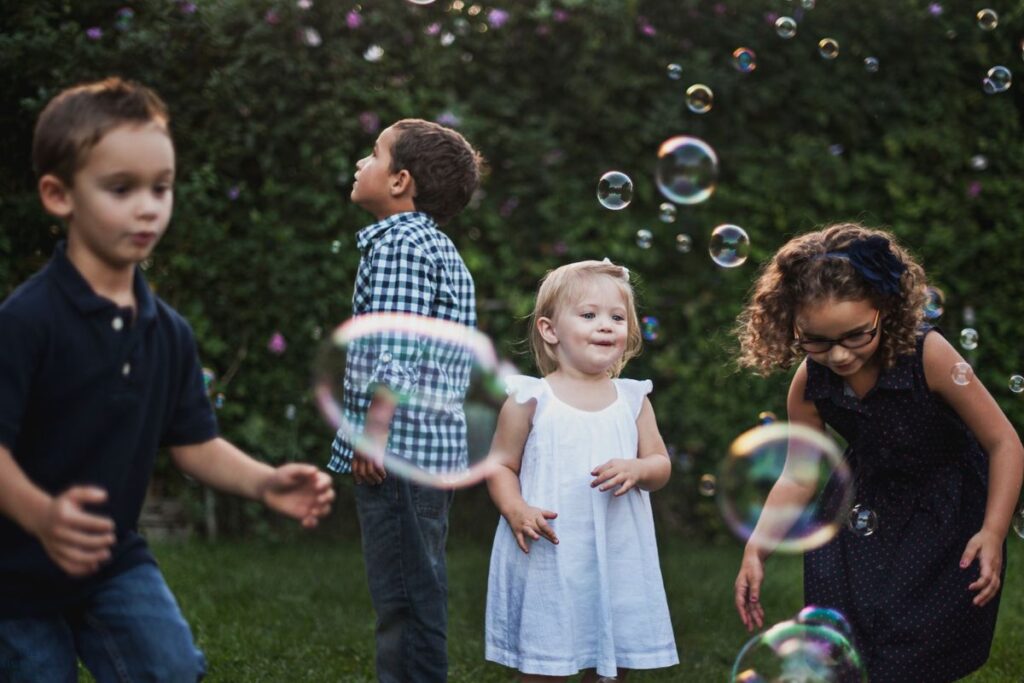 children playing with bubbles