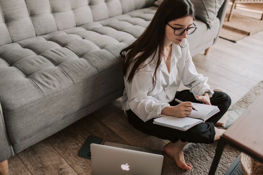 woman writing in a journal