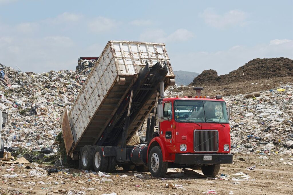 trash truck dumping garbage