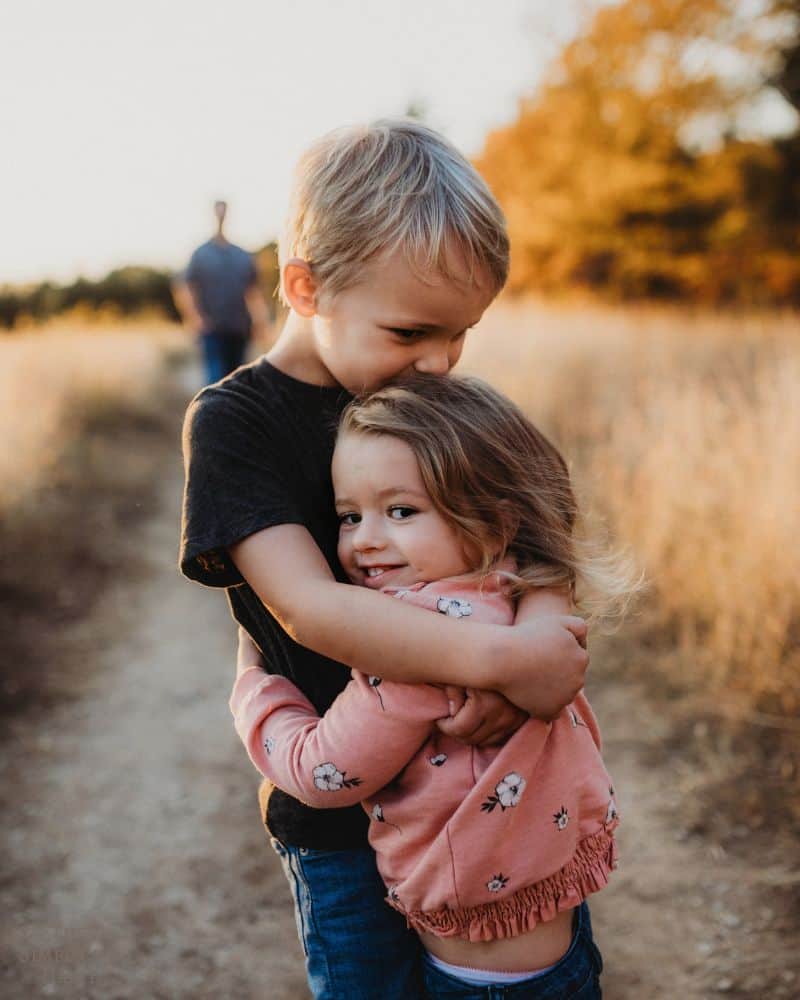 brother hugging sister