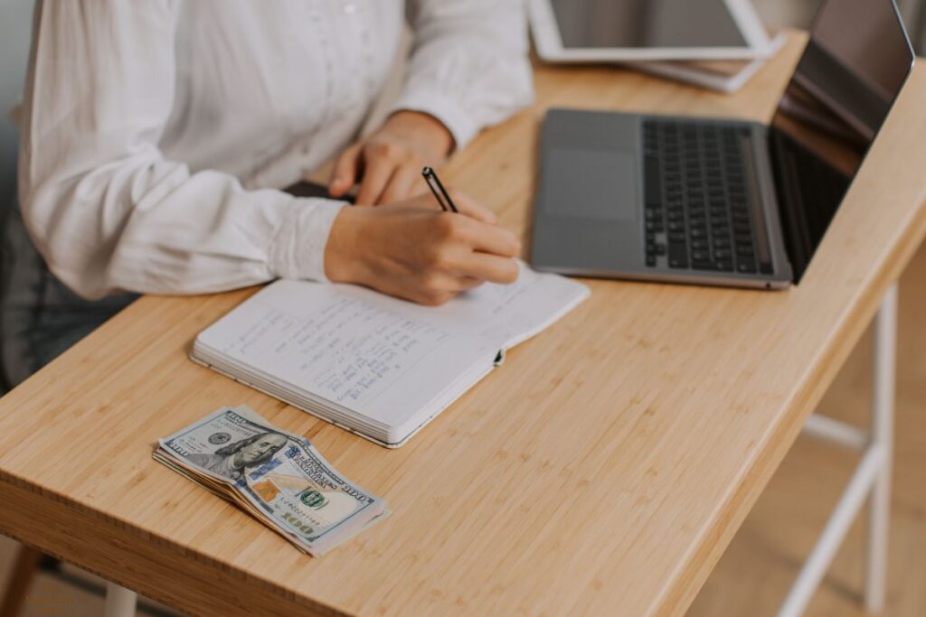 lady writing down financial information