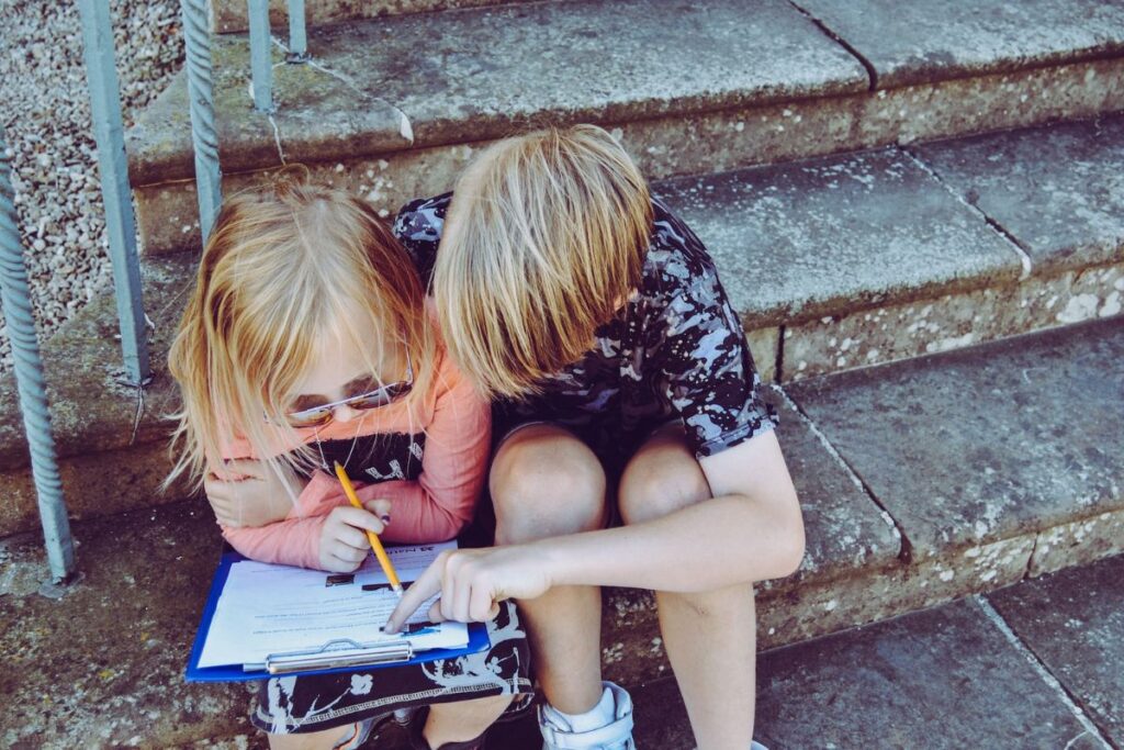 brother helping his sister