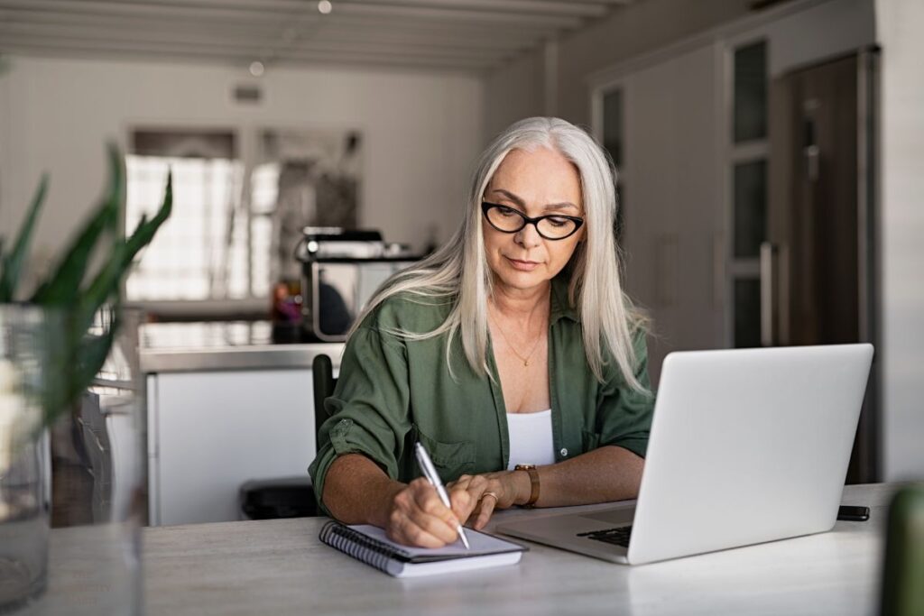 woman writing in a notebook