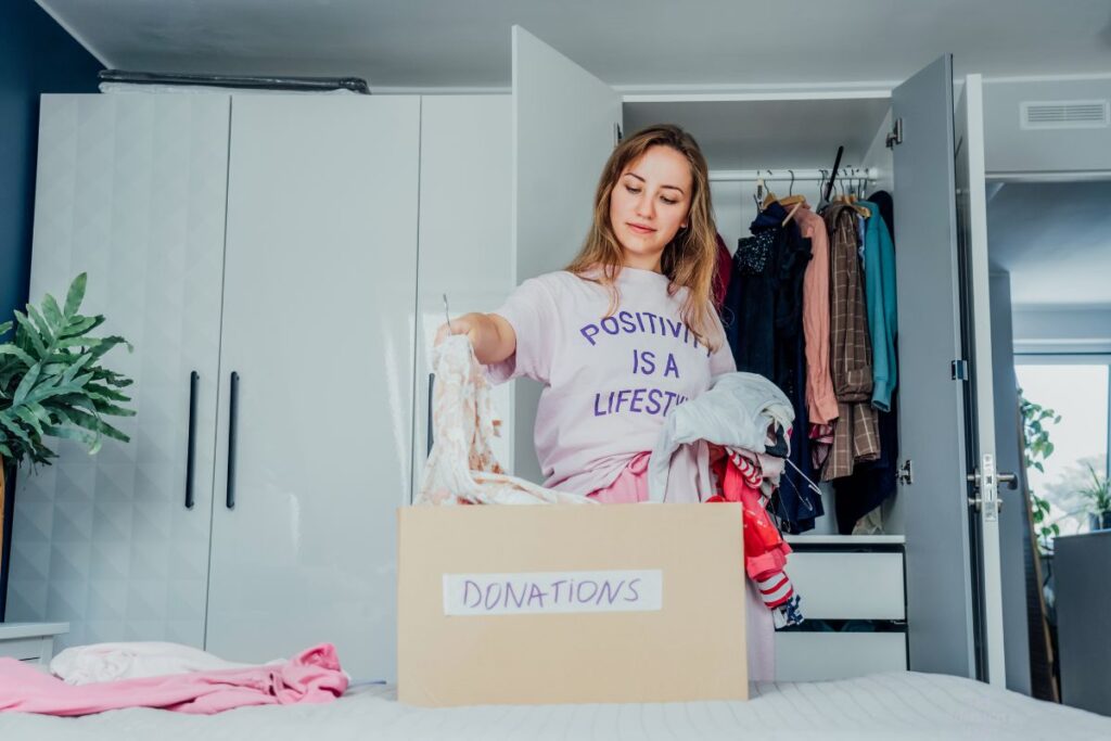 woman decluttering clothing