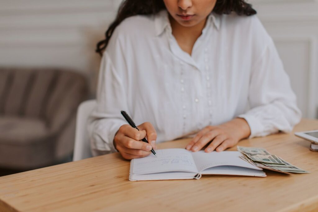 woman writing in a notebook