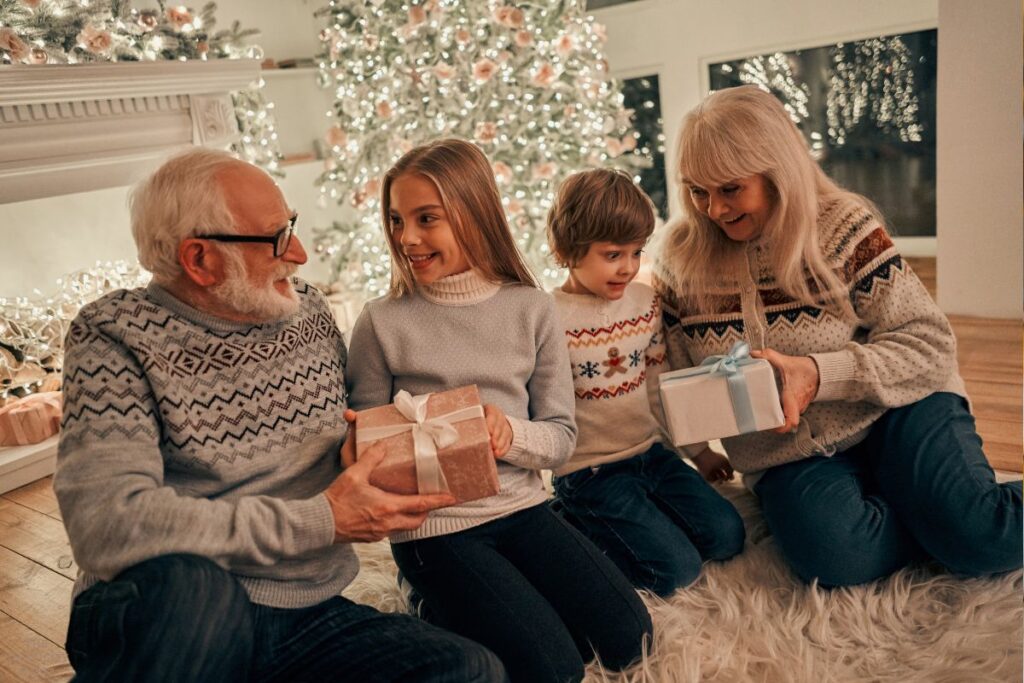 grandparents giving presents to grandkids