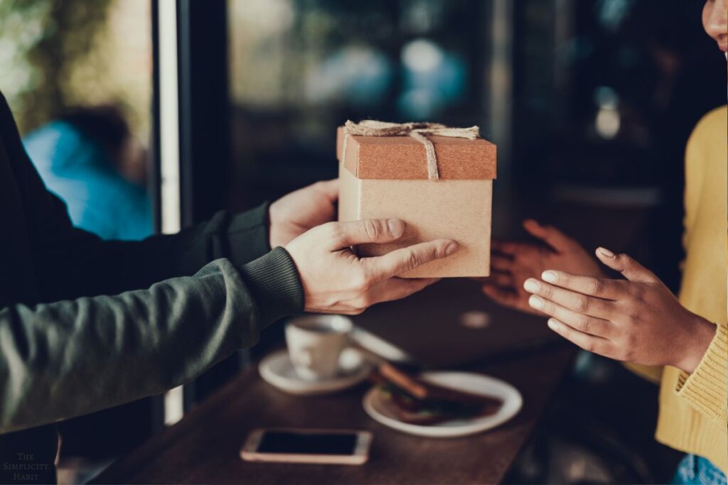 handing a present to a friend