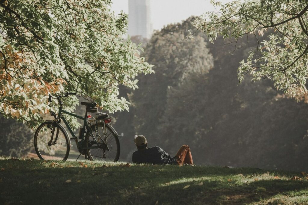 bike and man laying on grass