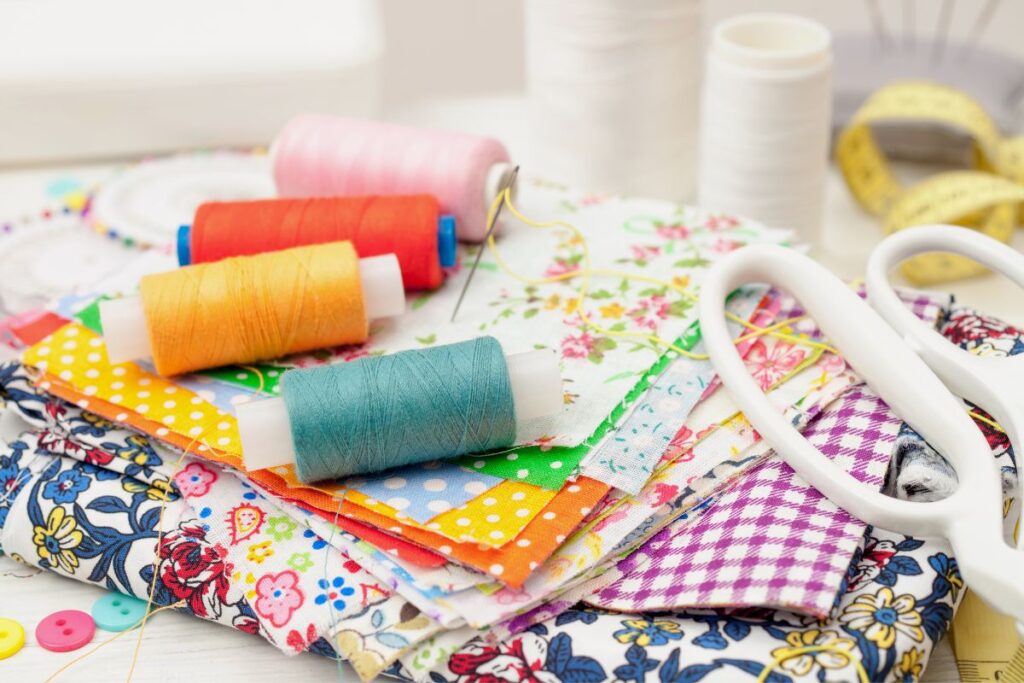 pile of thread and scraps of fabric