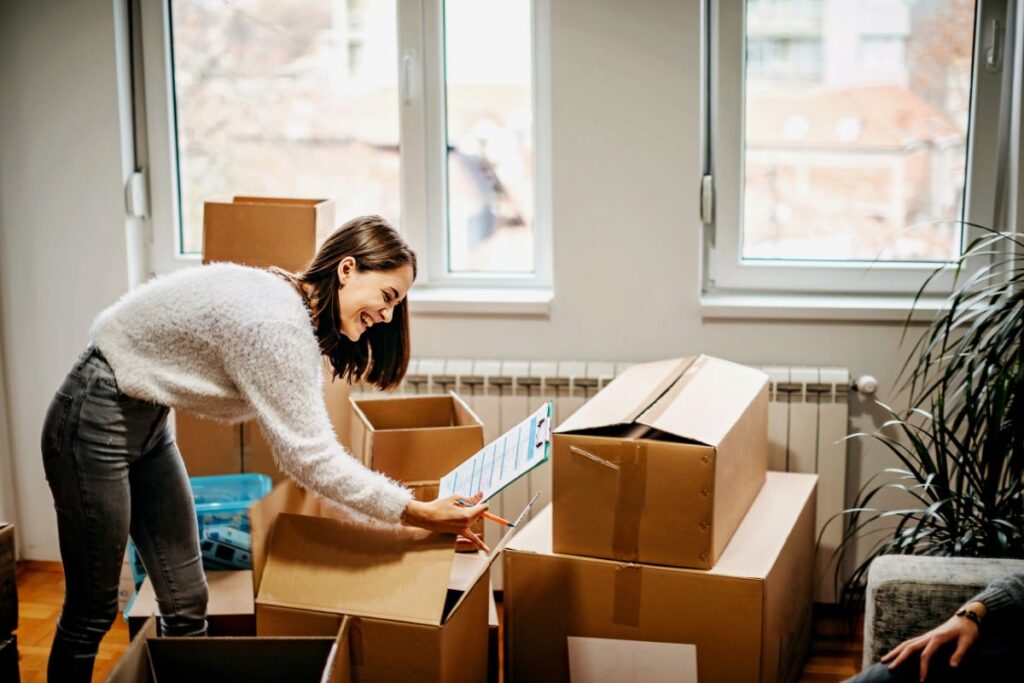 happy woman moving boxes