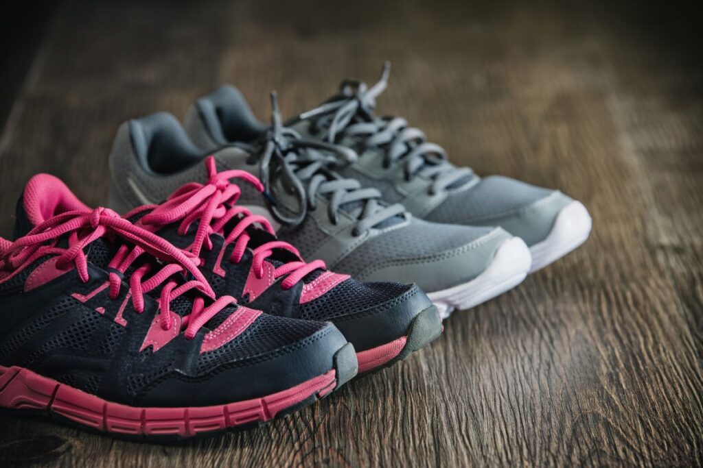 two pairs of tennis shoes on the floor