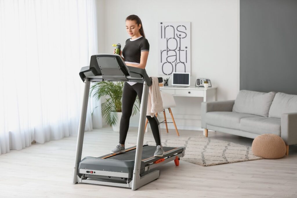 woman using a treadmill at home