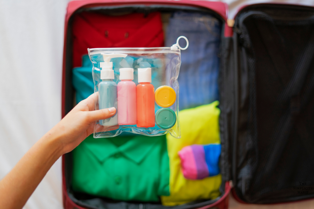 putting toiletries into a suitcase
